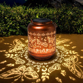 IYEZIGI butterfly solar lantern with cutouts creates enchanting garden illumination.