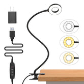 iZELL desk lamp clipped to bed headboard for cozy nighttime reading
