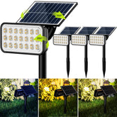 JACKYLED 84-LED solar spotlight front view highlighting landscape features