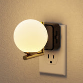 JandCase LED night light plugged into a wall provides a warm 3000K glow for safe navigation.