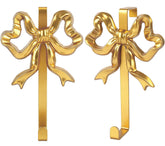 JarThenaAMCS gold bow door hook on a door adds festive charm and practical storage