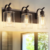 JAZAVA ZCVL01ORB-3 vanity light with bronze finish and clear glass shades for warm glow.
