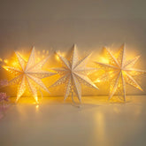 JINKEYULV paper star lanterns 3-pack illuminate windows with a warm, festive glow