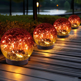JKIMK Solar Globe Light with cracked glass ball for garden ambiance at night.