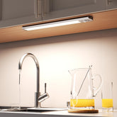 Joyzy under-cabinet light with motion sensor for hands-free illumination.