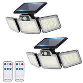 JumJam 280 LED solar flood light brightening outdoor porch at dusk.