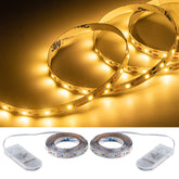 JUNWEN battery-powered short LED strip glows warm white, ideal for shadow box decor and DIY projects.