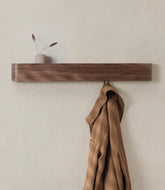 Kazai Toke wall-mounted coat rack side view highlights slim profile and hidden hooks.