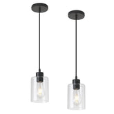 KLSS pendant light over kitchen island provides warm task lighting with a clear glass shade.