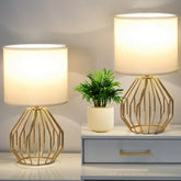 KRASTY small gold table lamp with white shade on a bedside table for soft illumination
