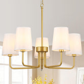 Kveosv modern gold chandelier over dining table with warm ambience