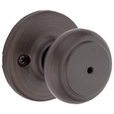 Kwikset Cove interior privacy knob with lock, ideal for private bedroom or bathroom doors.