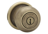 Kwikset Juno entry knob front exterior in antique brass shows secure entry for home use
