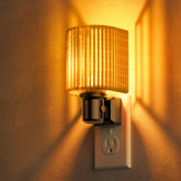 L LOHAS LED night light with amber boho shade for warm ambience in any room.