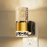 L LOHAS LED night light plugged into outlet for gentle hallway illumination.