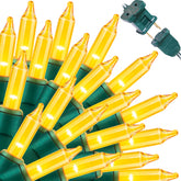 LAMPHOME Christmas string lights with 100 yellow bulbs brighten indoor spaces warmly.
