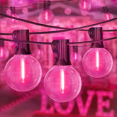 LAMPHOME pink G40 bulbs create romantic outdoor glow for Valentine’s Day.