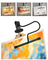 Lamptobe clip-on easel light securely grips surfaces for painting sessions.