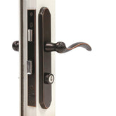Larson Revere mortise handle set assembly in aged bronze for secure, stylish entry.