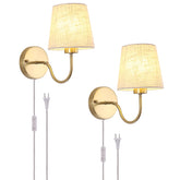 LASENCHOO plug-in wall sconce in brass finish with fabric shade for warm bedroom glow.