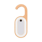 Leapair wooden memo light glows on a doorknob with motion sensing.