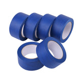 Lichamp blue painter's tape on a wall for a clean edge during painting.