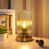 LightRound table lamp with amber shade for cozy reading ambiance.