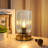 LightRound touch table lamp with glass shade offers gentle bedside lighting for evenings.