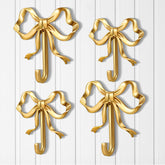 Lineshading gold bow knot hook for coats and hats at the entryway.