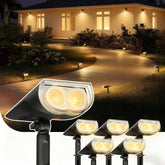 Linkind StarRayS spotlight lighting a tree with warm white glow for ambiance.