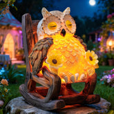 LIULO TOOL light-up owl on chair sculpture brightening an outdoor patio