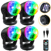 Luditek disco ball light 4-pack on desk creates vibrant party ambience.