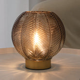 LUSHARBOR amber-glass table lamp provides portable ambience on any surface.