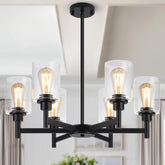 Lynnoland black chandelier with six clear glass shades for a dramatic dining space.
