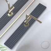 Lyxel faucet mat by the kitchen sink showing rapid water absorption.