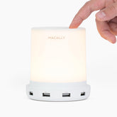 Macally small touch lamp on nightstand with USB ports for easy charging.