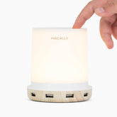 Macally small touch lamp on nightstand with USB port for fast charging.