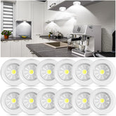 Macarrie 12-pack wireless LED puck lights mounted under cabinet for bright, energy-efficient lighting.