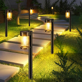 Mancra solar pathway lights 10-pack with glass lampshades brighten garden paths safely at night.