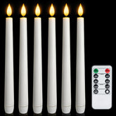 Meigic flameless taper candles with remote timer glow softly on a dining table.