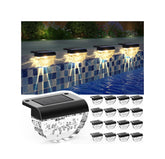 Melunar solar deck lights with warm white glow illuminating outdoor spaces