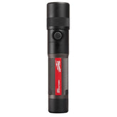 Milwaukee rechargeable 1100-lumen flashlight shows bright beam on a work site.