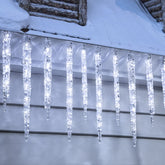 Minetom Icicle Lights illuminate outdoor eaves with twinkling tubes for festive curb appeal.