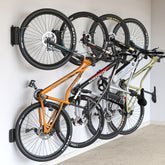 monTEK Swivel Bike Wall Mount four-pack packaging demonstrates space-saving storage solution