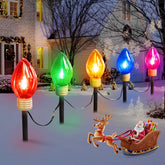 Moonflor jumbo C9 pathway lights illuminate outdoor paths with multicolor bulbs.