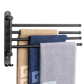 NearMoon four-arm swivel towel rack on wall with space-saving design.