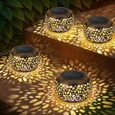 NFEVER solar lantern with hollow pattern casts warm garden glow on porches