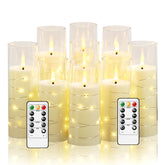 Nimiko flickering flameless candles with embedded star string in ivory finish.
