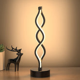 NUÜR Infinity Spiral lamp with black base enhances modern ambience in living rooms