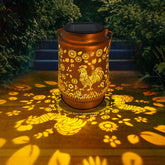 OFEWPAGA chicken solar lantern hanging on patio provides ambient outdoor lighting.